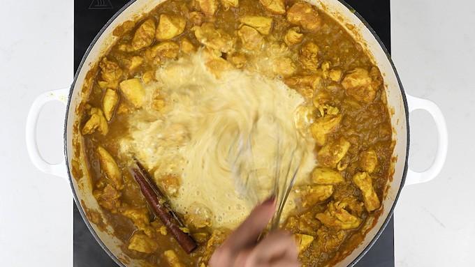 Stirring Fromage Frais into pan of Slimming World Chicken curry