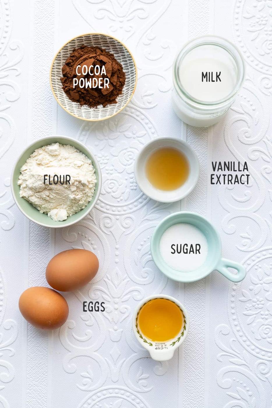 chocolate pancakes ingredients laid out in small bowls