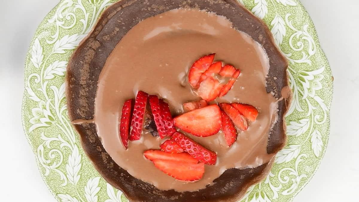 Chocolate crepe filled with Nutella and strawberries