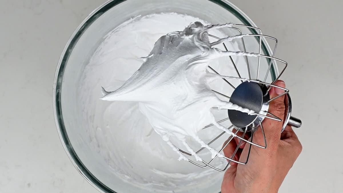 meringue holding stiff peaks on whisk