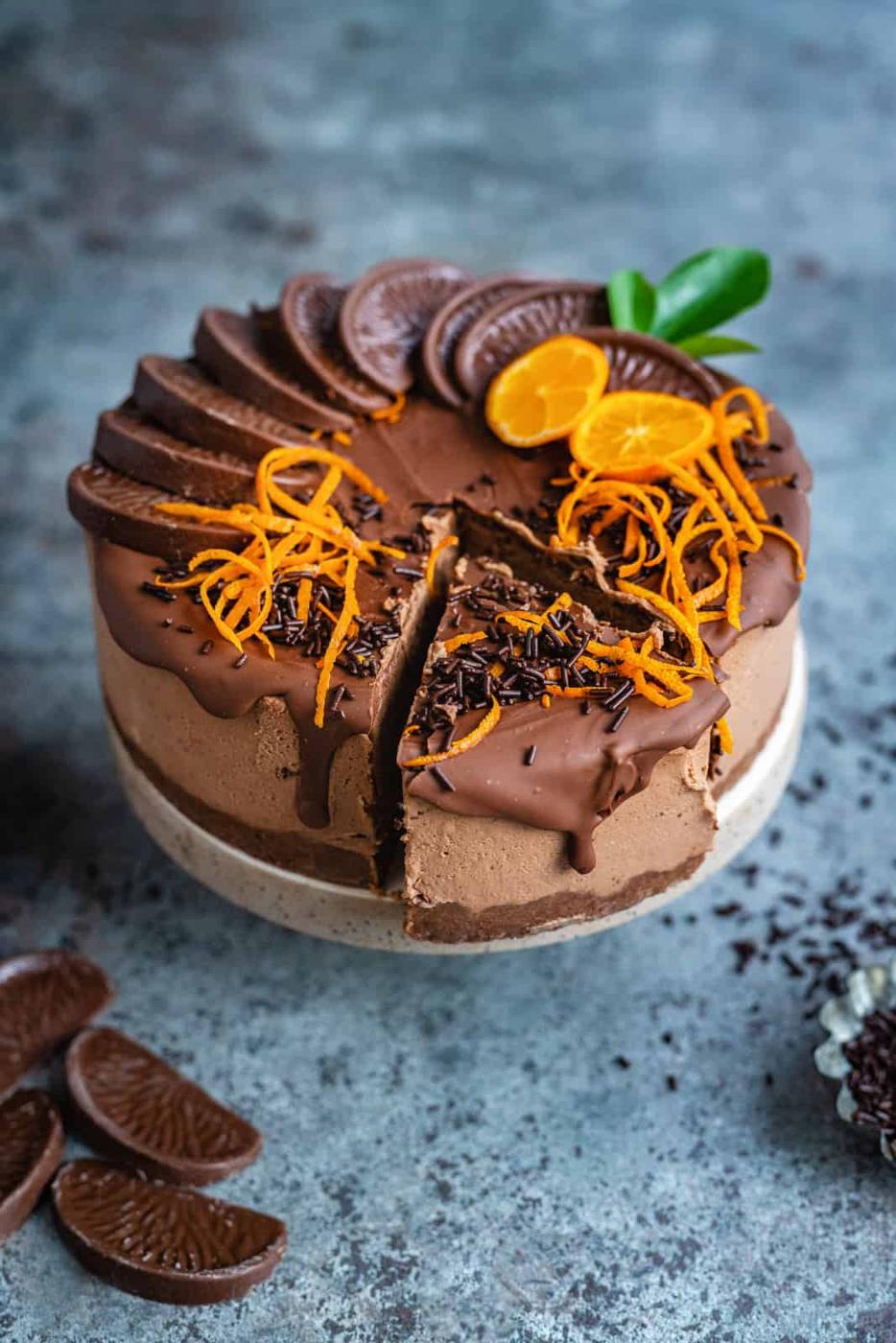 Chocolate orange cheesecake with one slice cut
