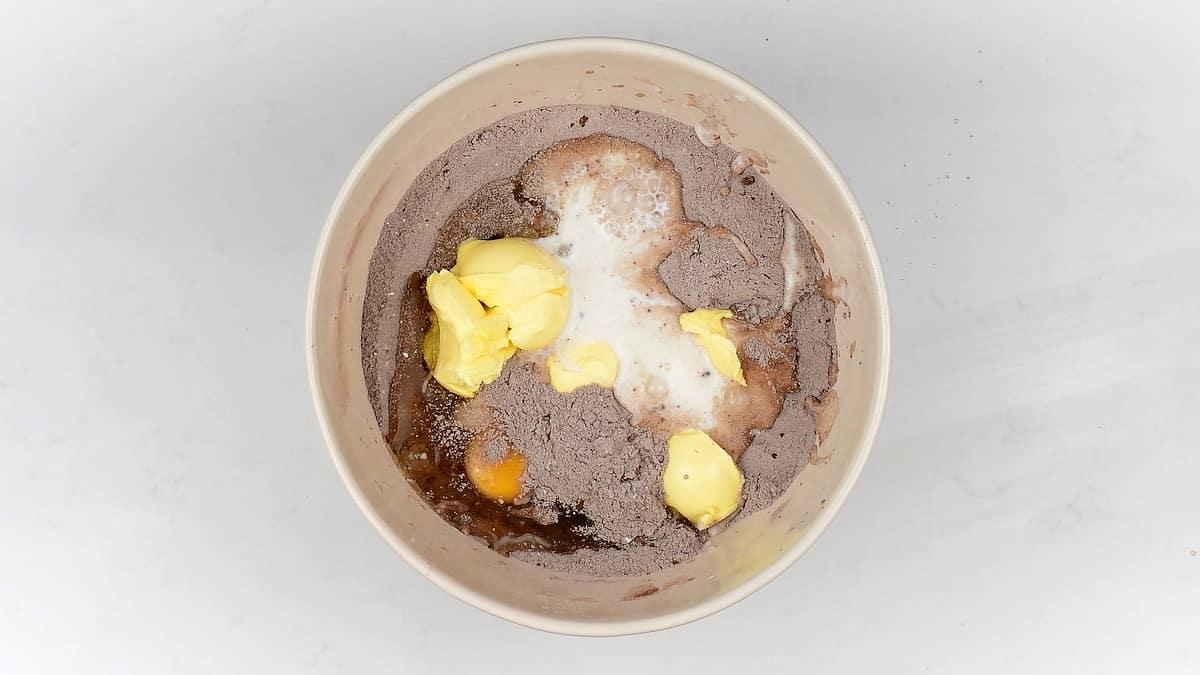 Ingredients for chocolate cake in a large mixing bowl