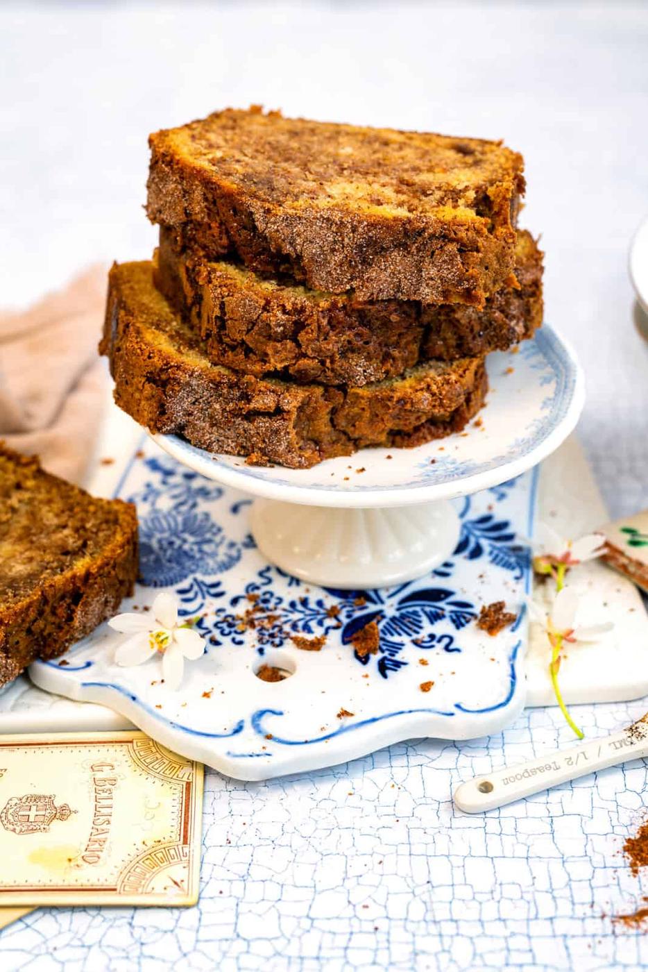 Slices of cinnamon bread stacked on a small cake stand