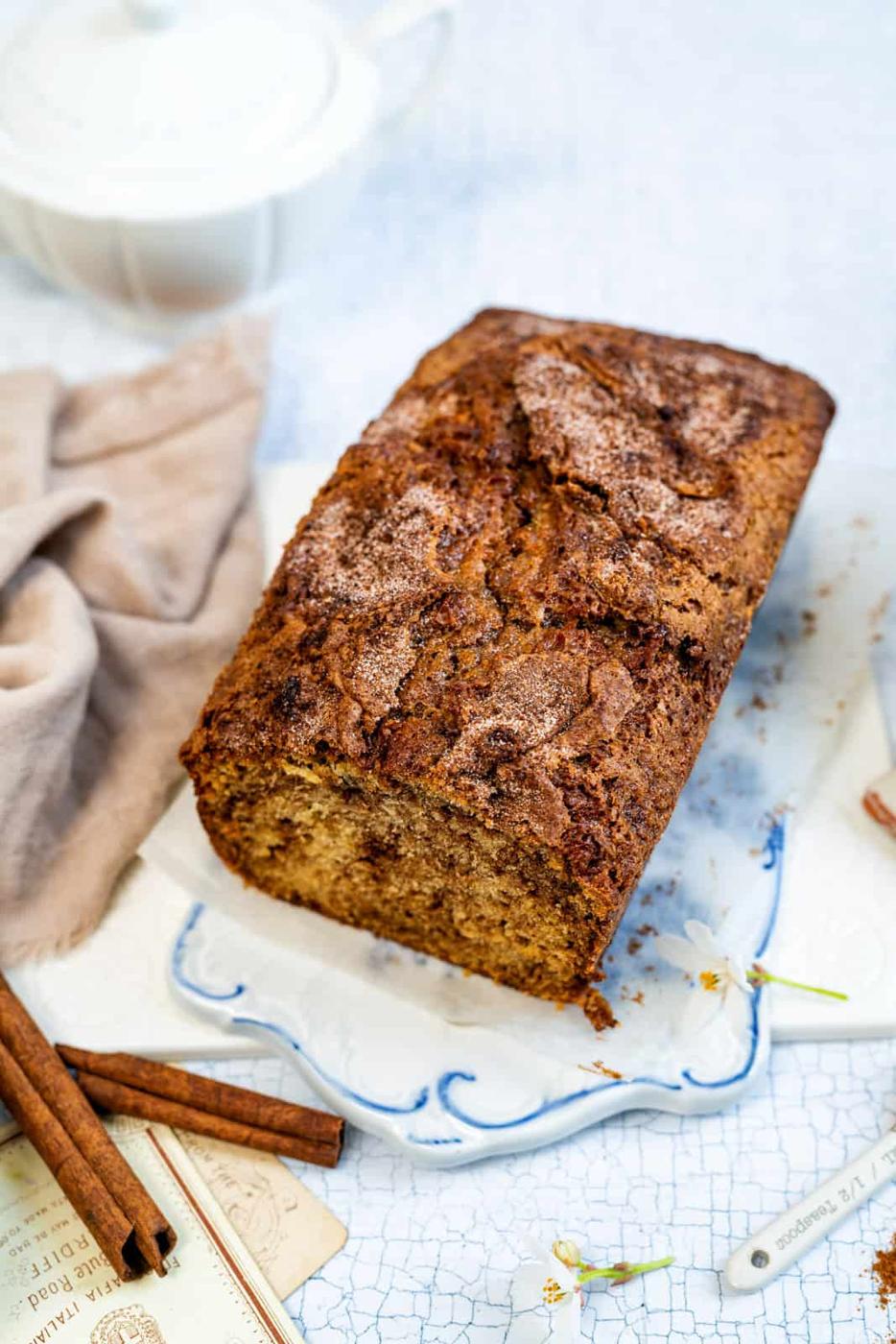 Cinnamon loaf with slice cut on a ceramic board