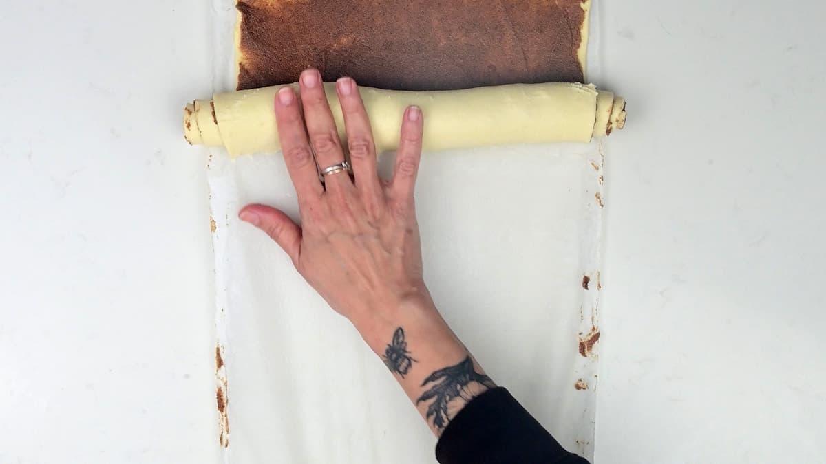 Rolling puff pastry into a log