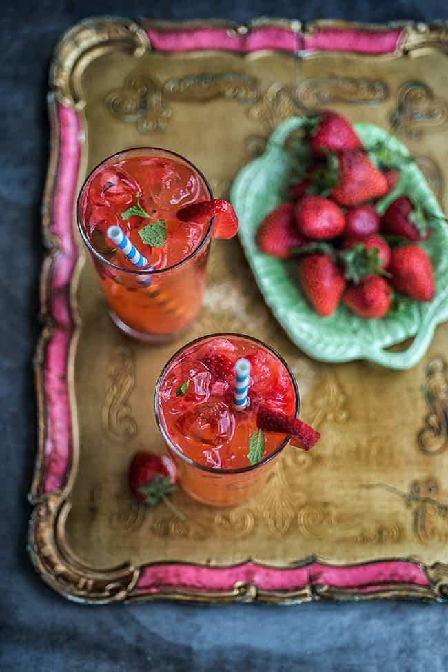 Moscow Mule Cocktails in two tall glasses on an ornate tray