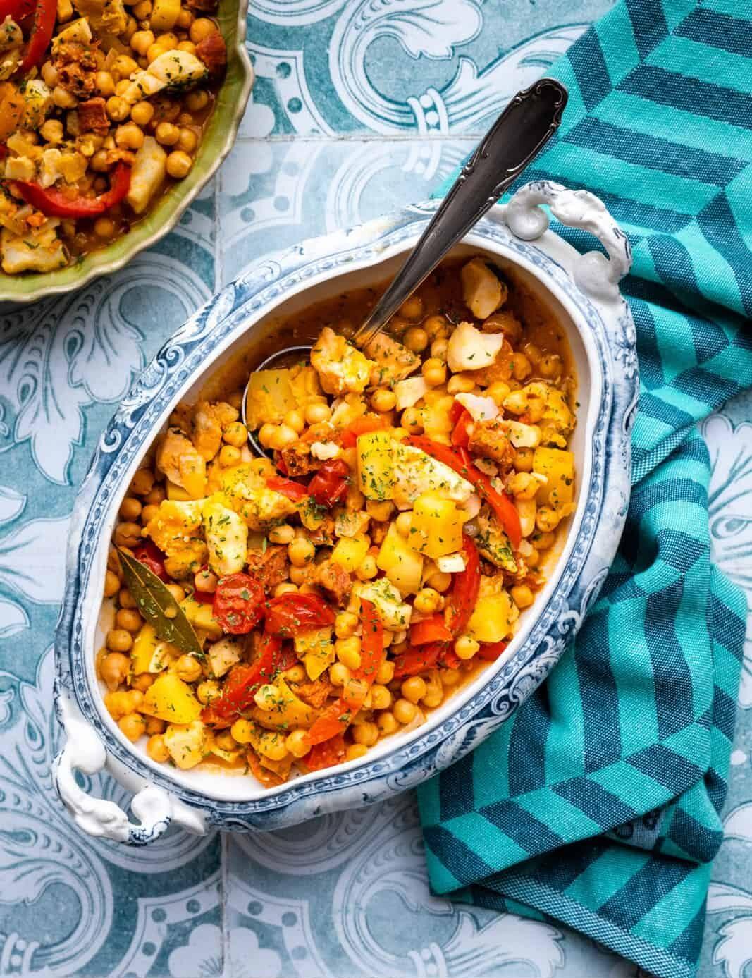 Cod and chorizo stew with chickpeas, peppers, tomatoes served in a tureen