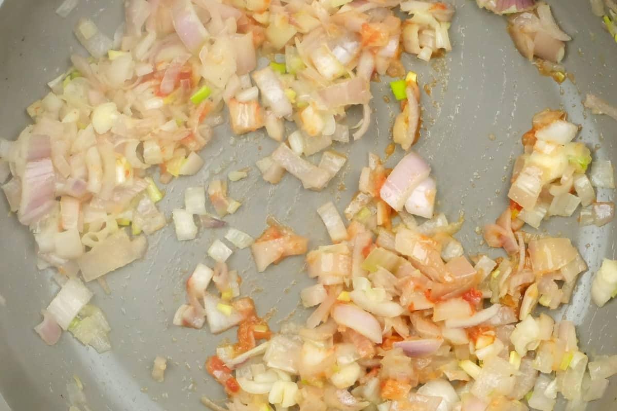 frying shallots in a pan