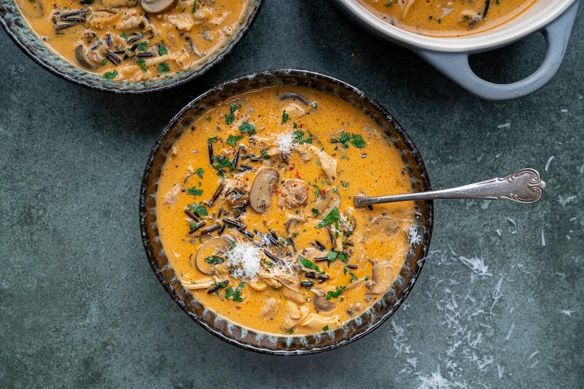 bowl of chicken soup with wild rice and mushrooms