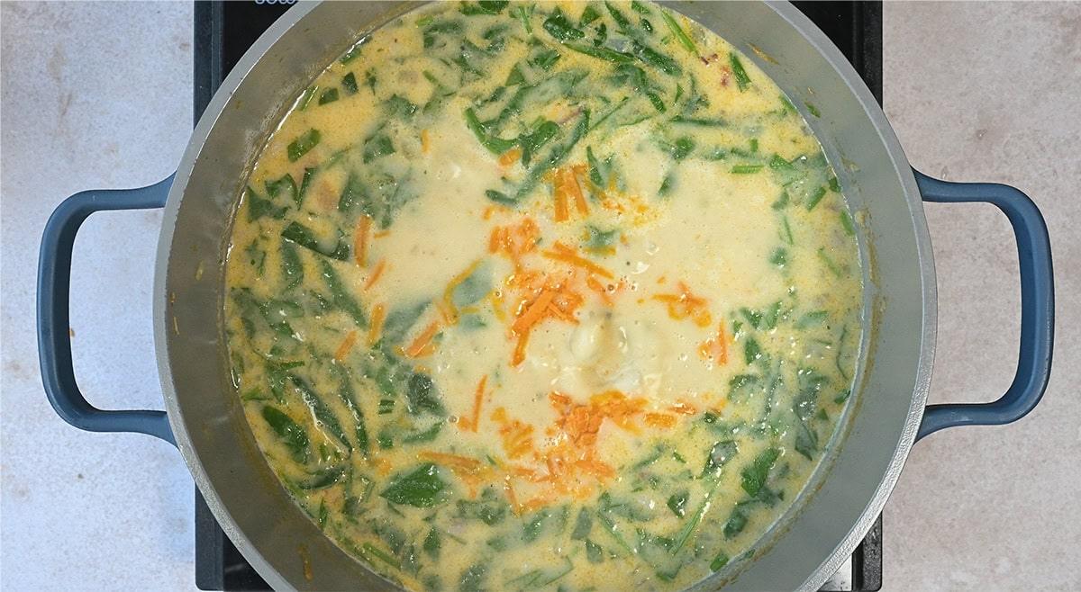 spinach and cheese added to creamy chicken potato soup