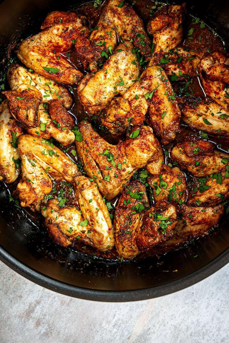 sticky chicken wings in a slow cooker, close up