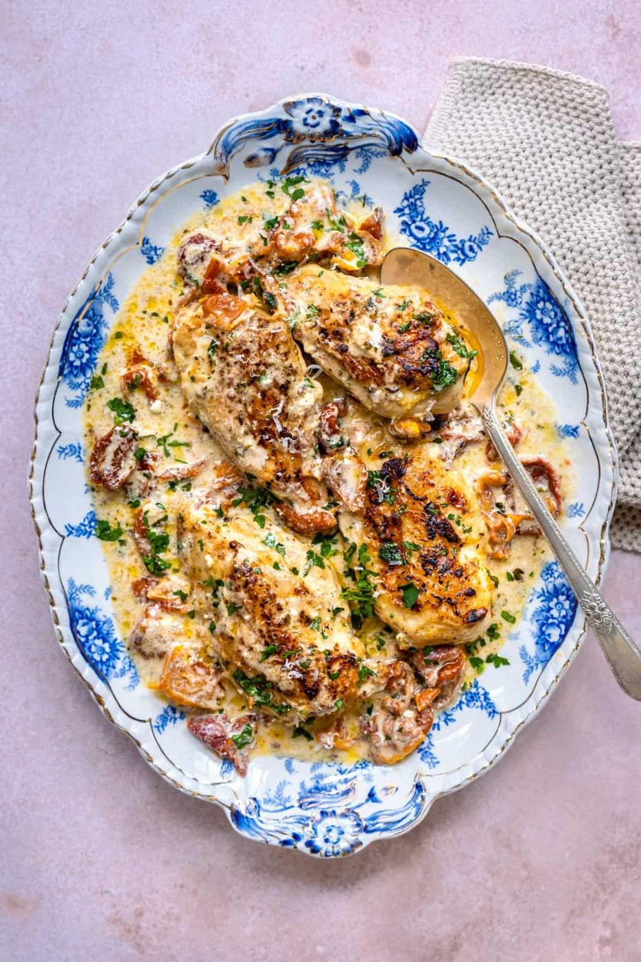 Platter of marry me chicken in creamy sauce with sun-dried tomatoes