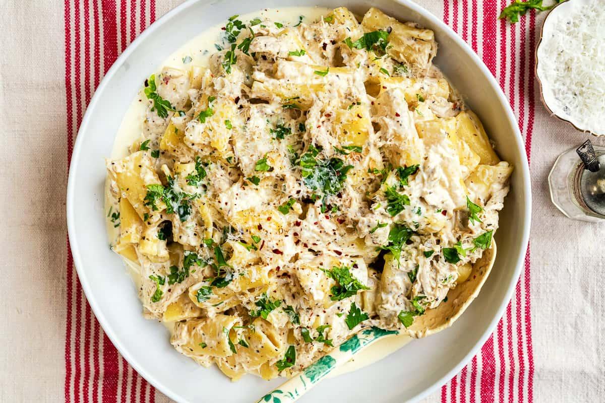 bowl of crockpot chicken pasta in a creamy sauce