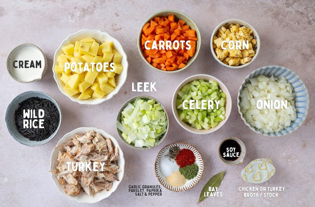labelled ingredients for turkey soup arranged on a table top in small bowls