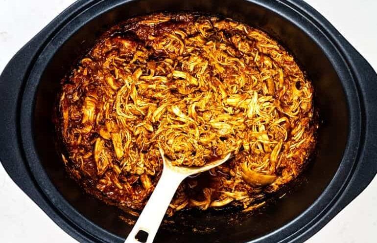 Shredded BBQ chicken in a slow cooker