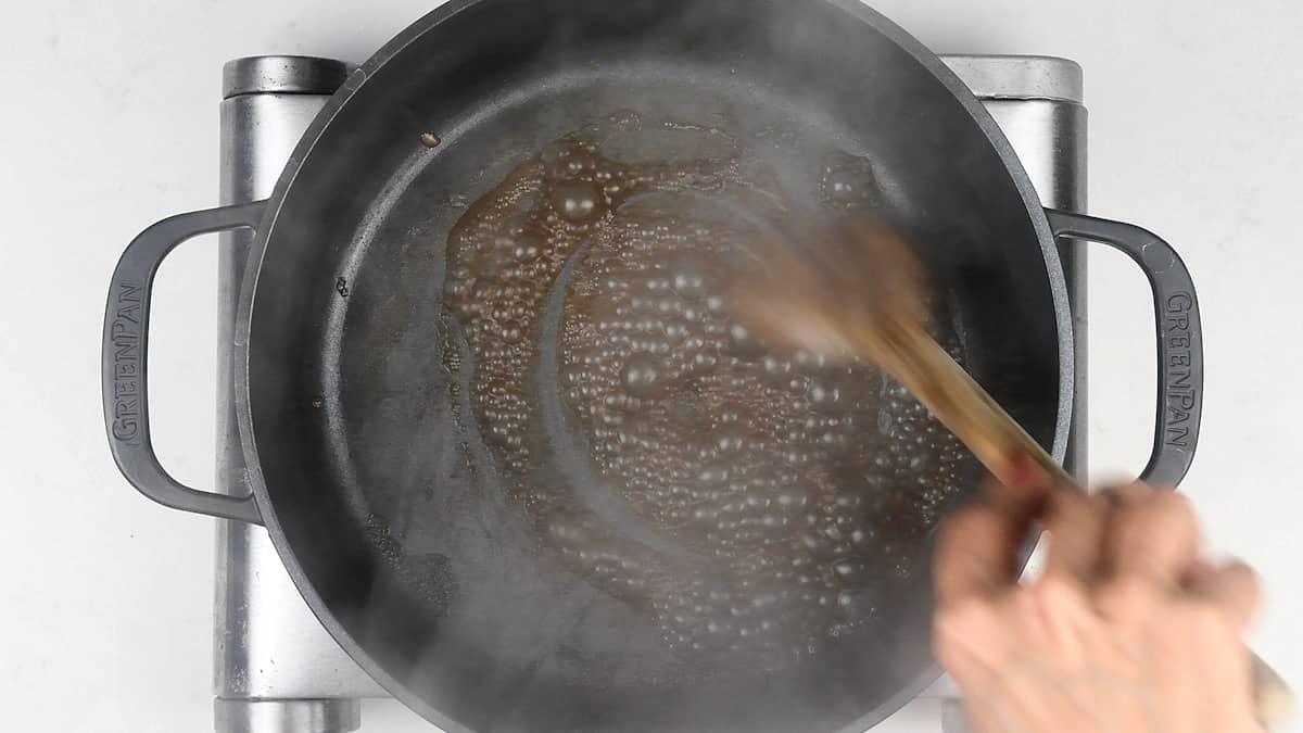 deglazing Dutch oven casserole with wine