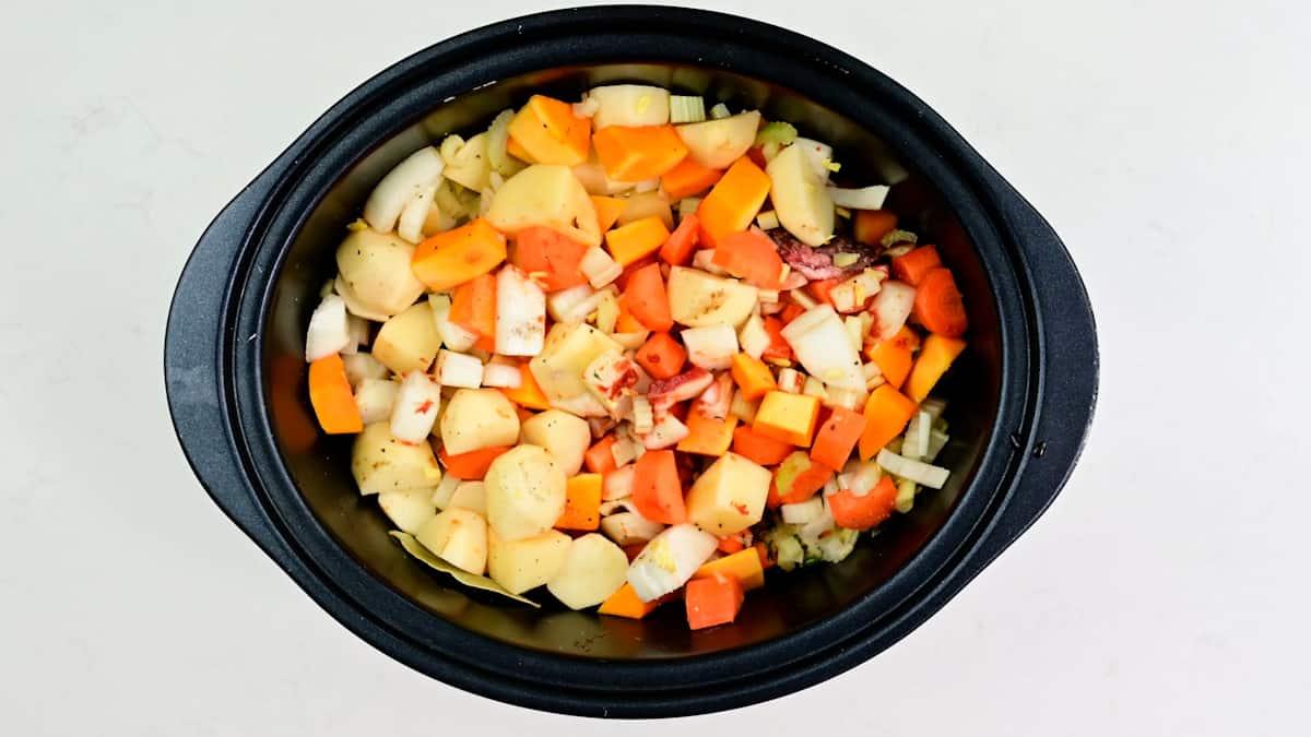 Ingredients for beef stew in a slow cooker
