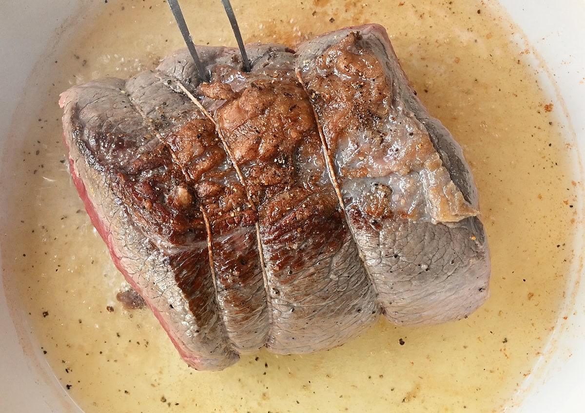 searing a beef joint, close up