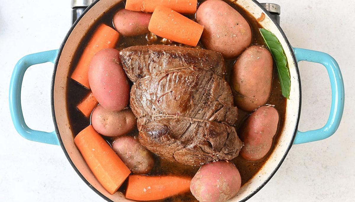 Carrots and potatoes with a beef joint