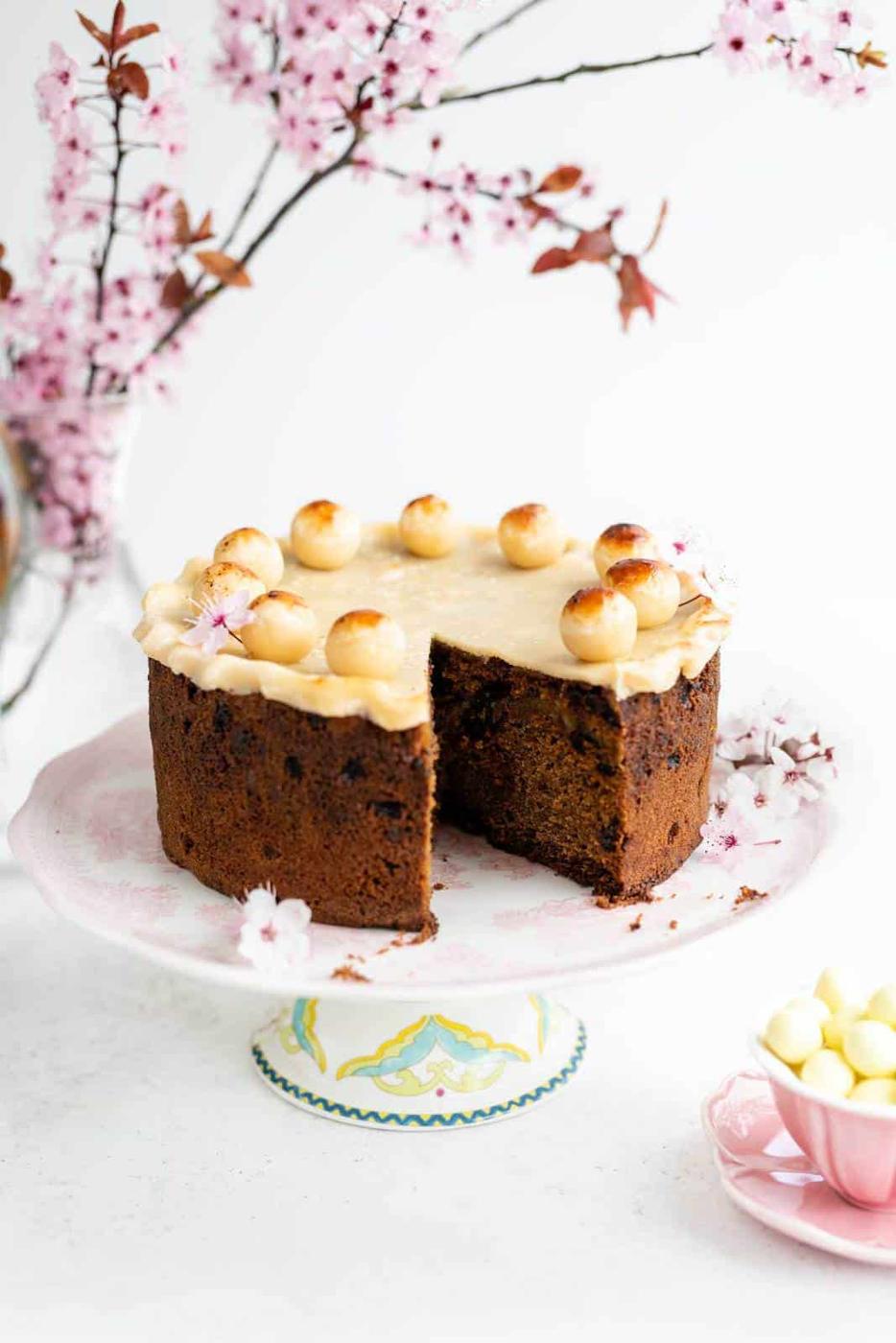 Simnel Cake on a cake stand with a slice taken out