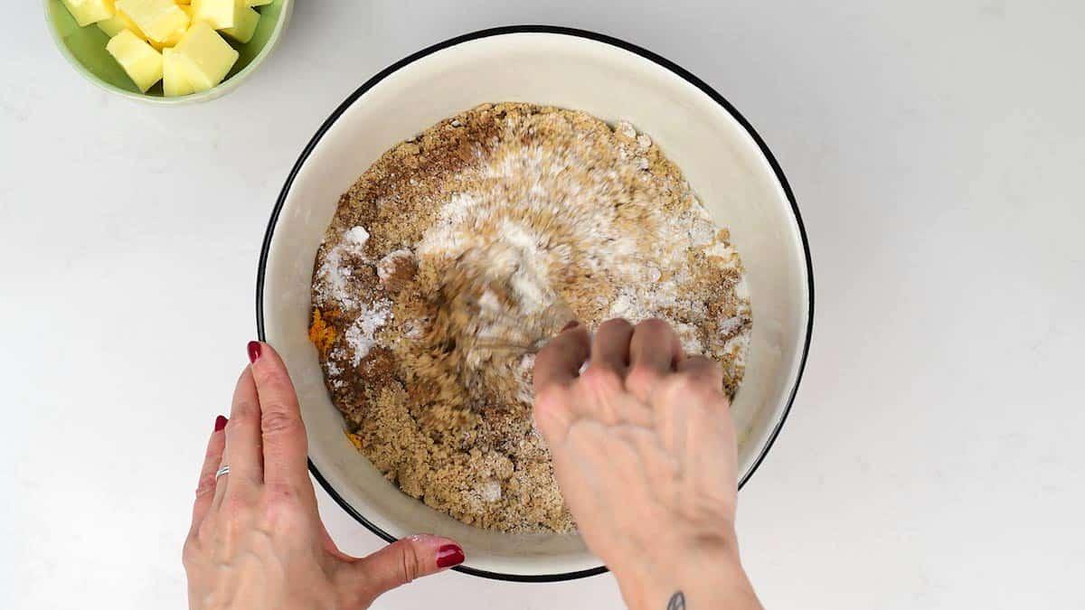 Mixing dry ingredients for Simnel Cake in a bowl