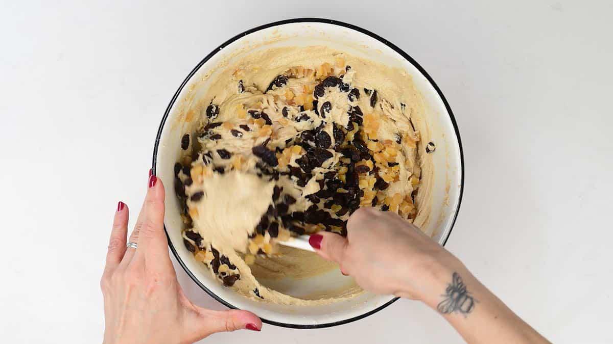 Folding dried fruit and citrus peel into cake batter