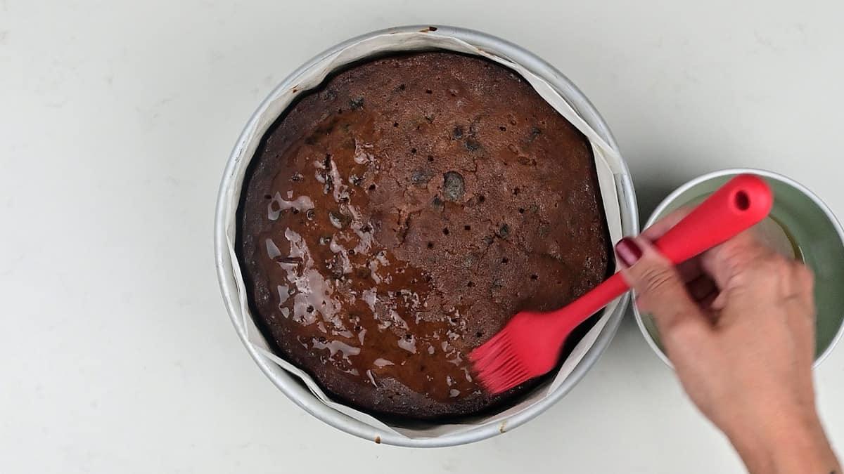 feeding Christmas cake with brandy