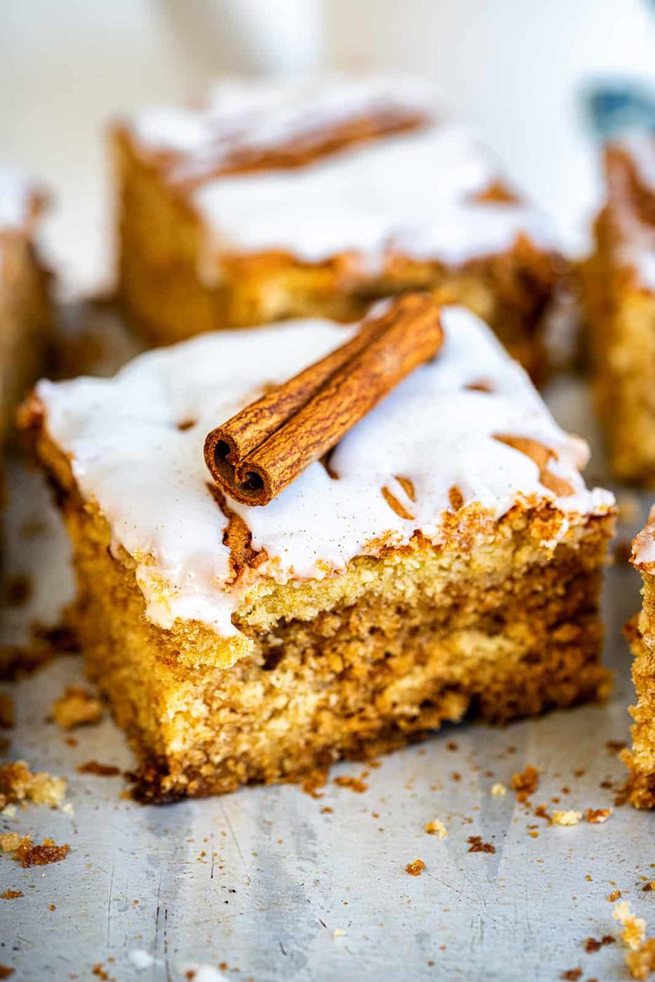 slice of cinnamon coffee cake decorated with cinnamon stick