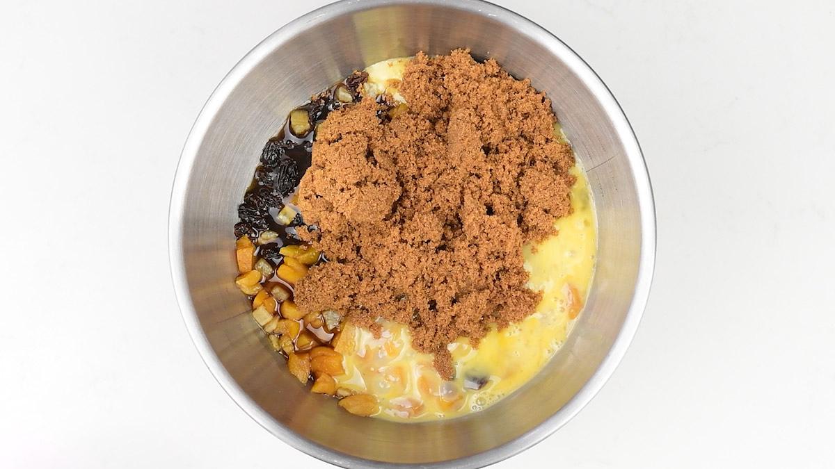 ingredients for fruit loaf in a mixing bowl