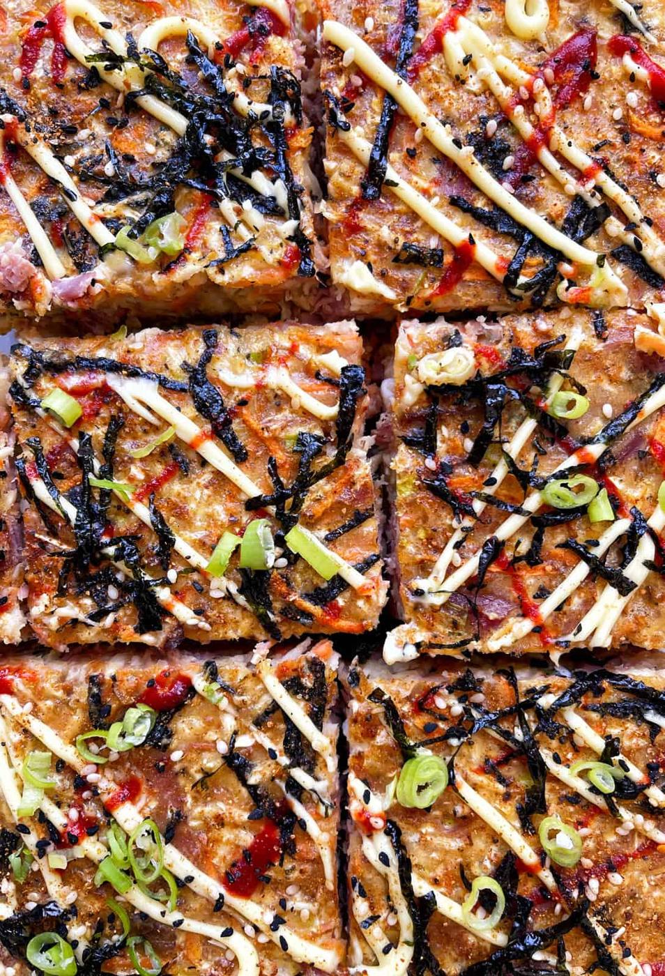 Overhead view of sliced oven-baked Okonomiyaki pancake