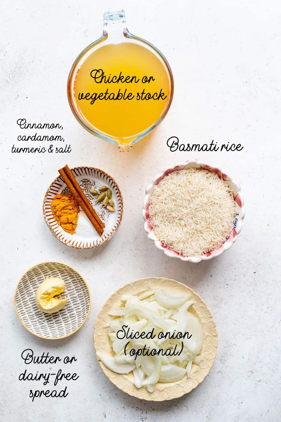 ingredients for pilau rice measured in bowls
