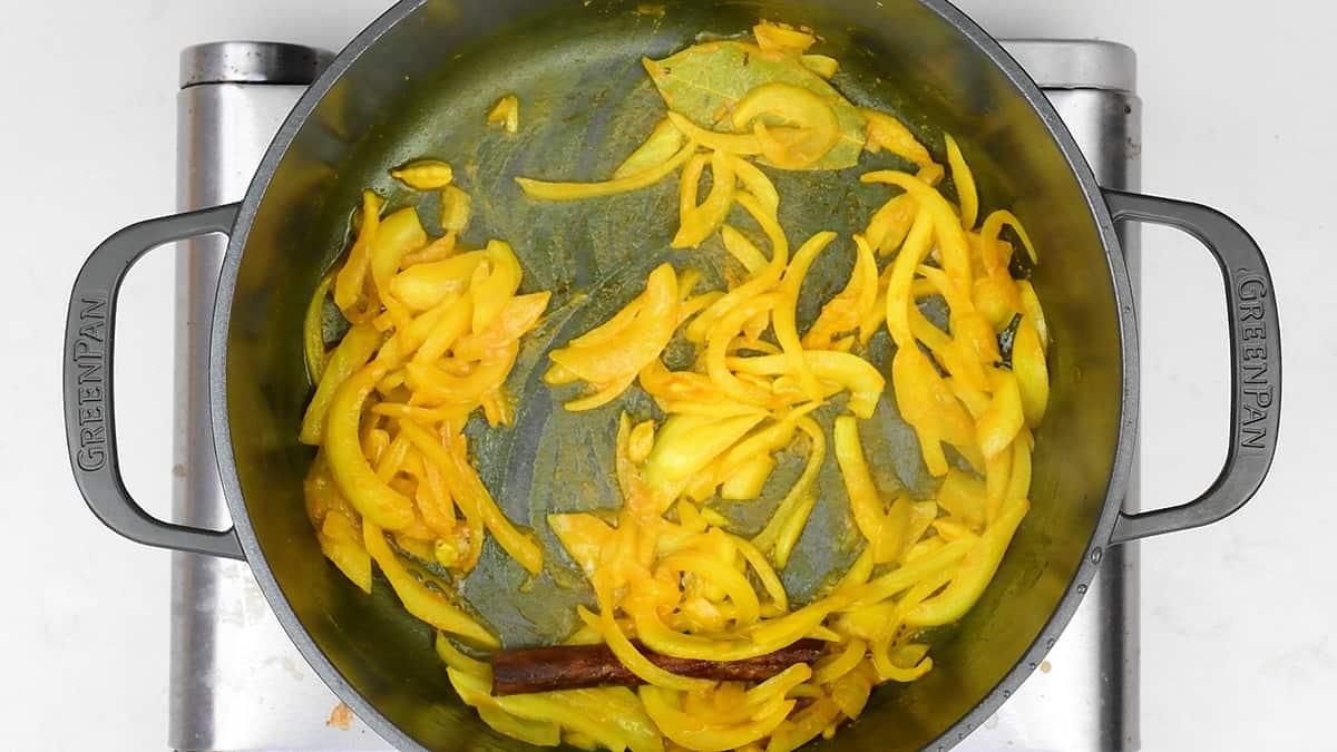 Sweating onions in spiced butter in a pot