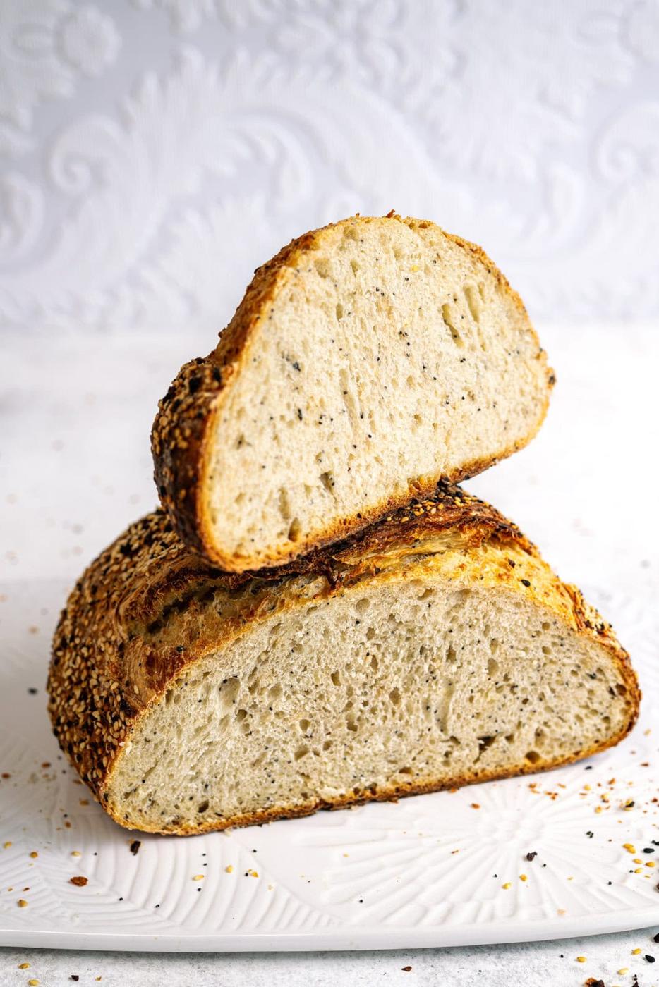 Everything Bagel Seasoning sourdough bread, sliced against a white background