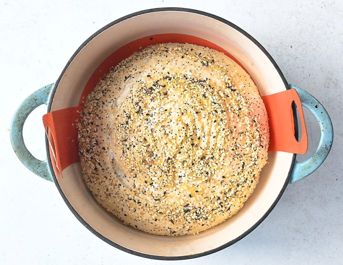 Everything bagel sourdough loaf in a Dutch Oven prior to baking