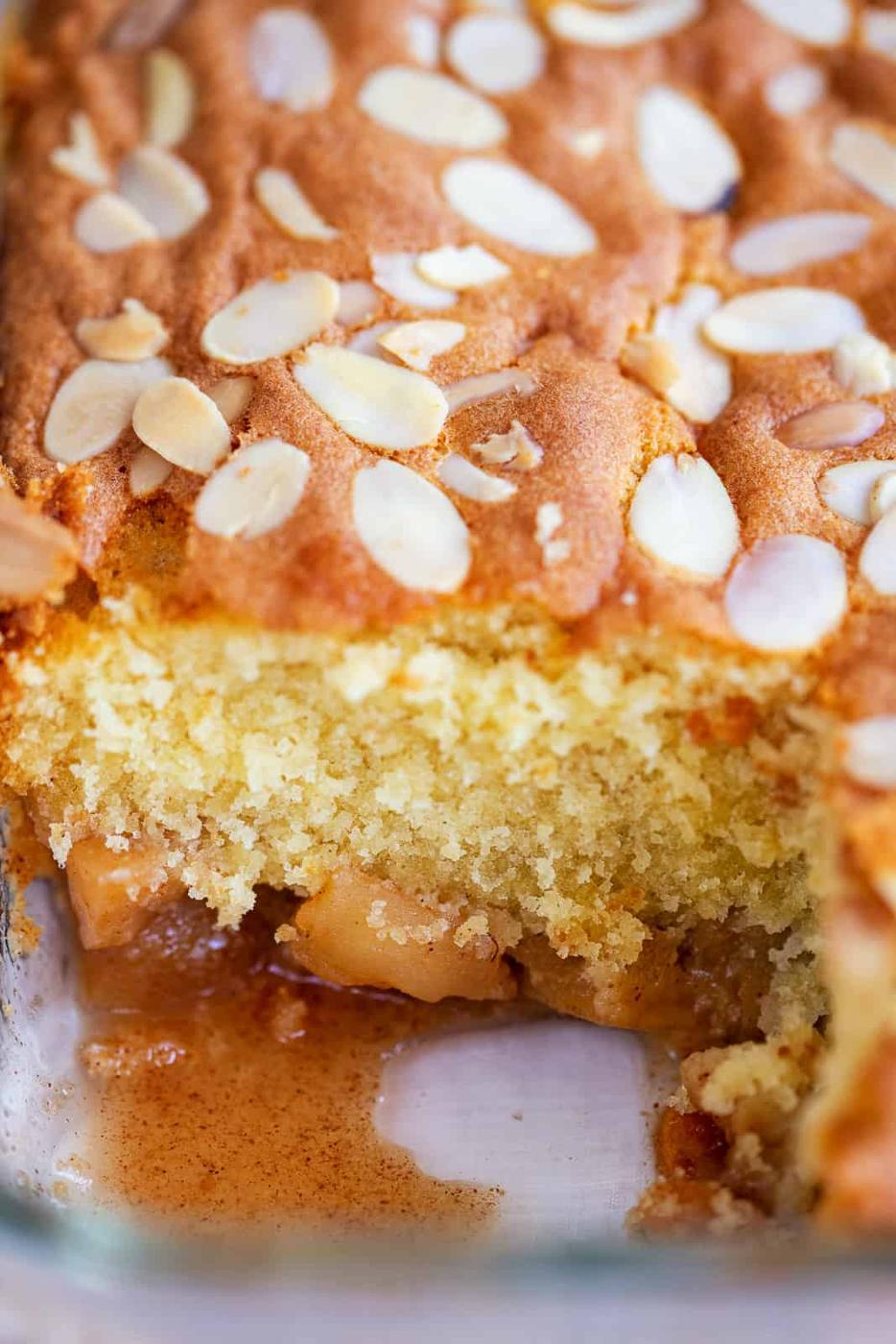 Close up on apple pudding with slice taken out