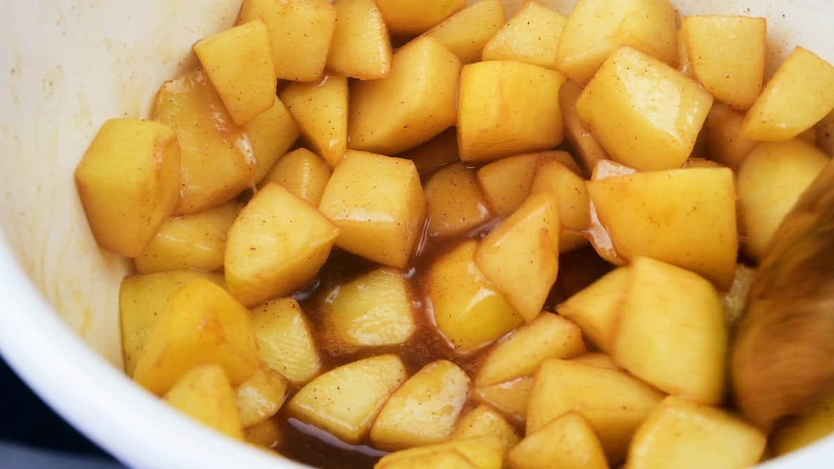 Close up on cubed apples cooked with butter and brown sugar