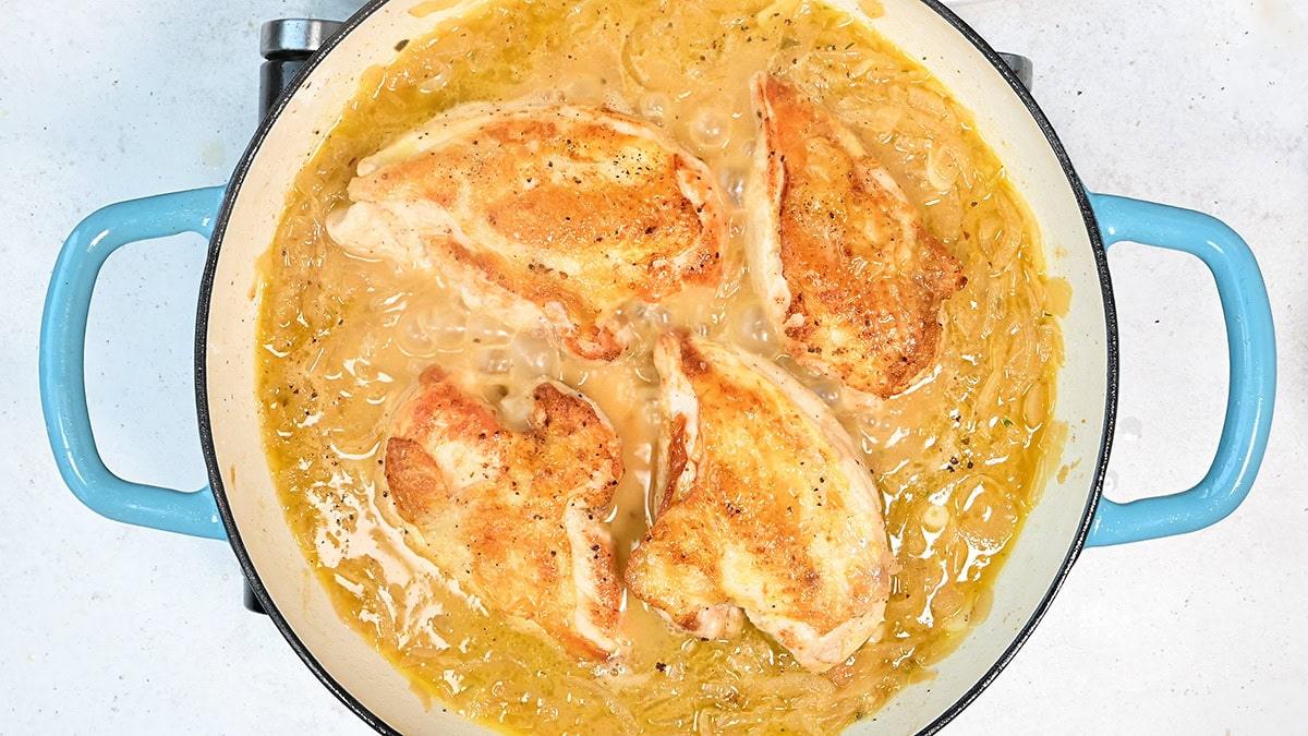 chicken breasts cooking in French onion gravy