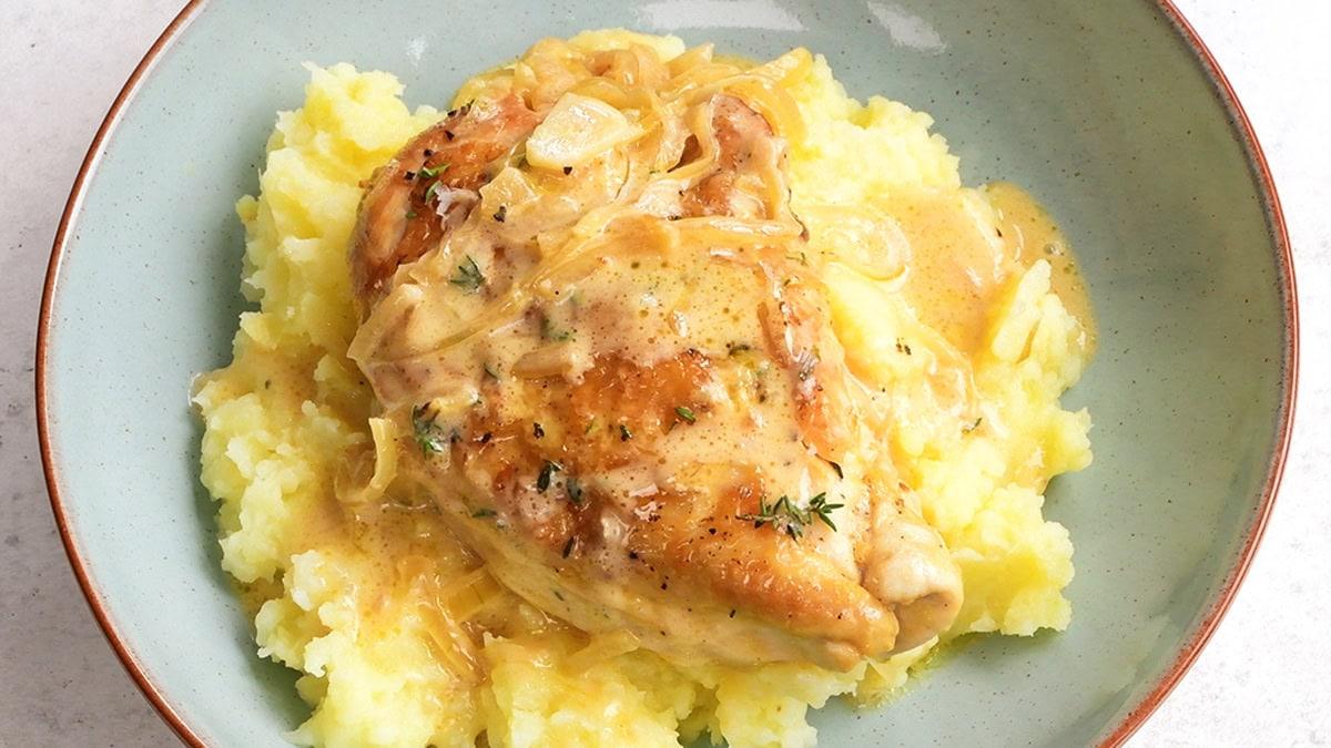 chicken breast served over mashed potatoes
