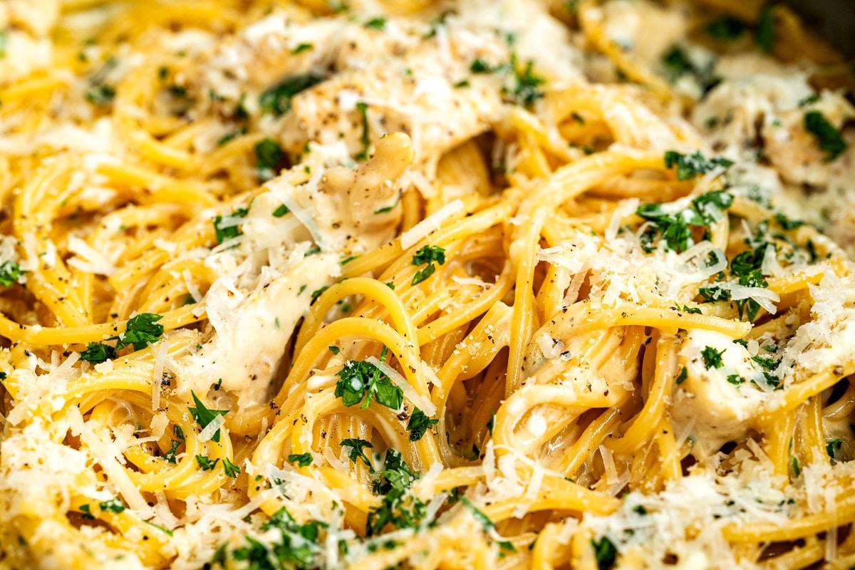 extreme close up on Garlic Parmesan Chicken pasta garnished with parsley