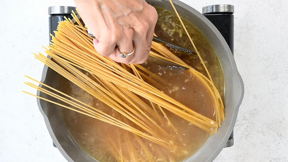 cooking spaghetti in broth
