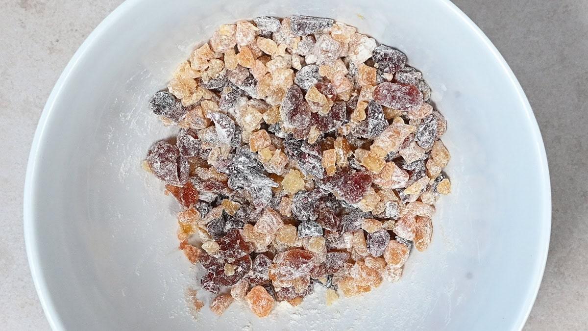 dried fruit in a bowl tossed with flour