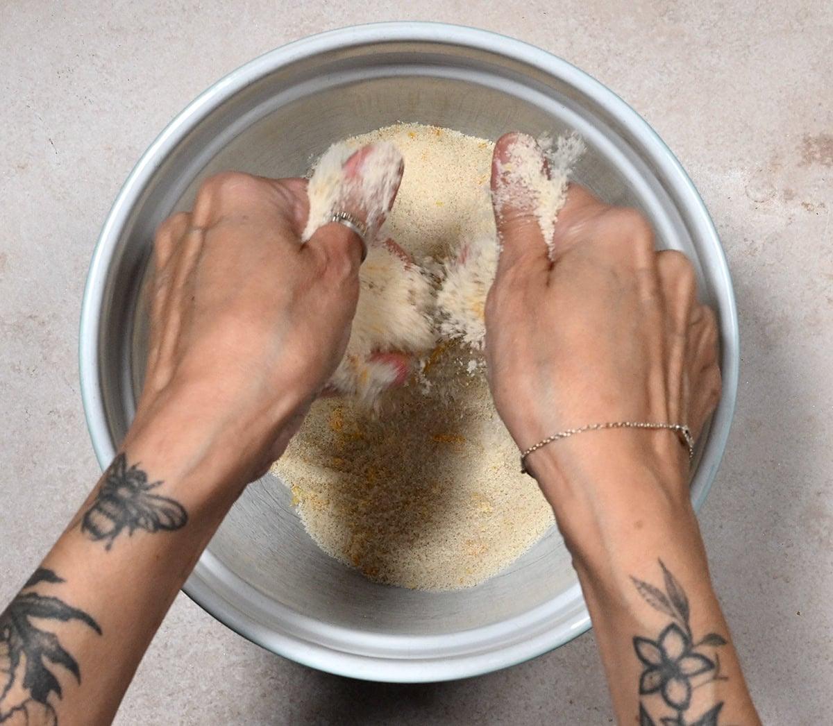 rubbing sugar and lemon zest with fingertips