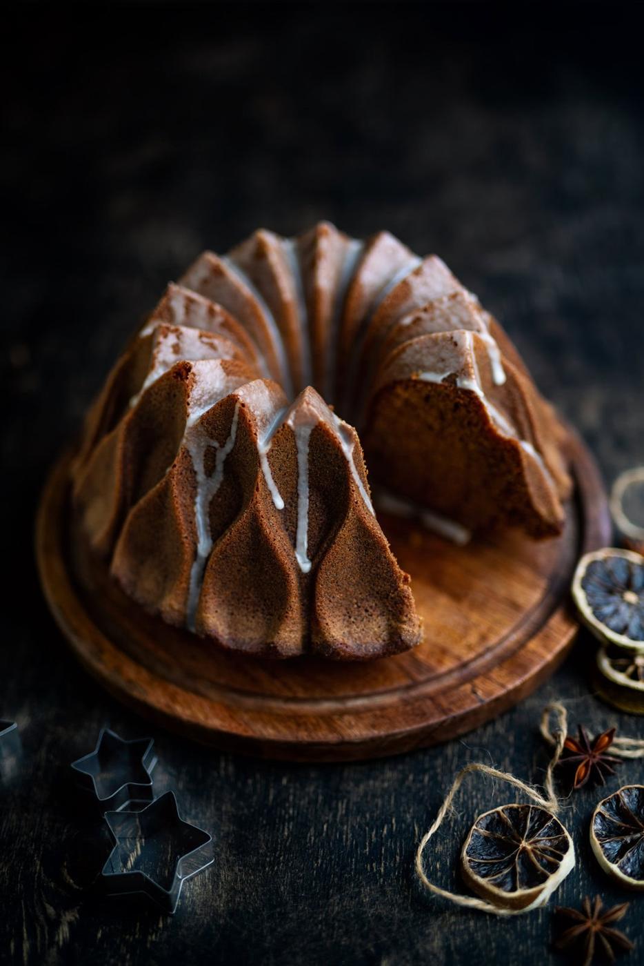 Sliced bundt cake on a wooden plate