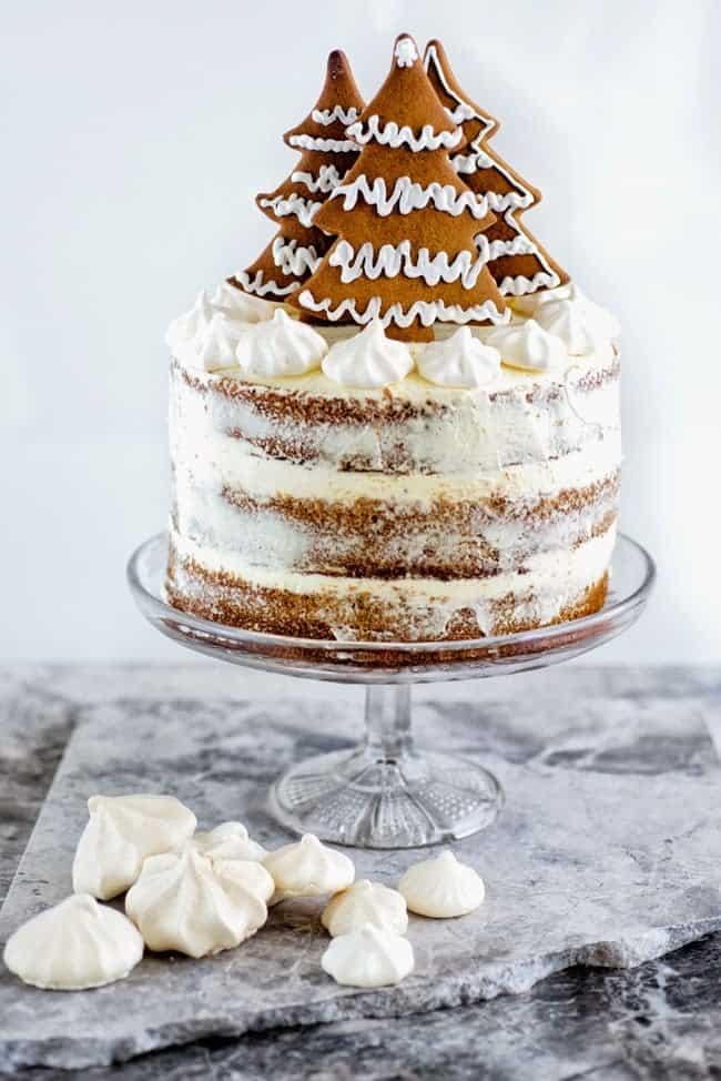 Gingerbread layer cake with cinnamon cream cheese frosting and gingerbread Christmas tree decoration