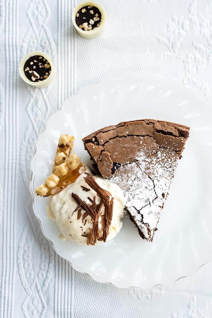 Gluten-free chocolate hazelnut torte with white chocolate praline ice cream