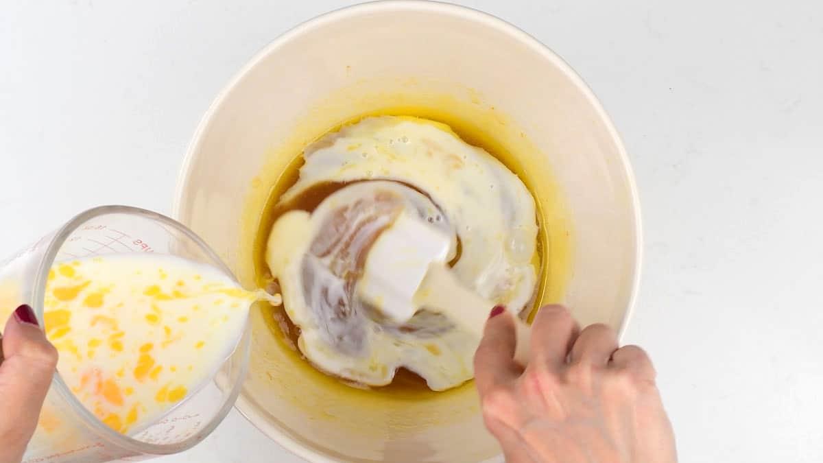 combining ingredients for golden syrup cake in a mixing bowl