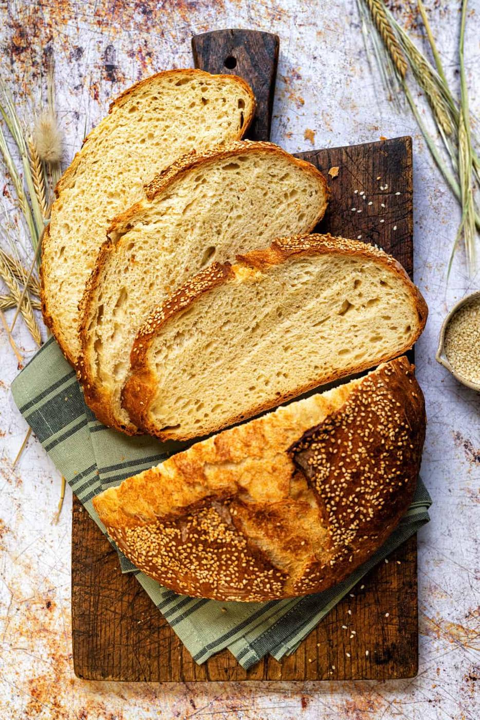 Make this traditional Greek village bread at home with just flour, semolina, yeast, salt, and water. Crispy crust meets soft, golden crumb—perfect for dunking in olive oil, pairing with Greek dips, or serving alongside dinner. Simple, rustic, unforgettable!