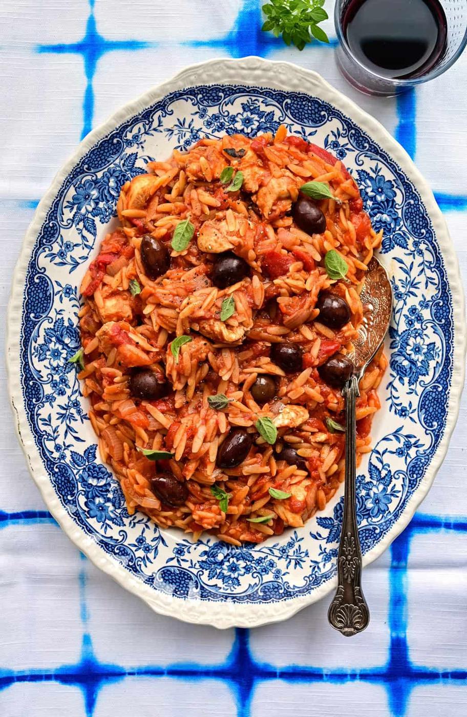 Chicken cooked with orzo and tomato sauce