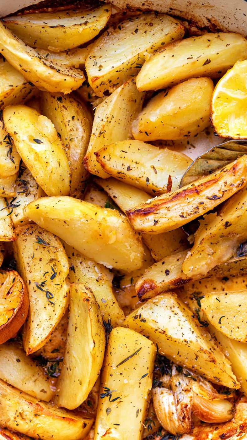 Close up on Greek Potatoes roasted with herbs and lemons