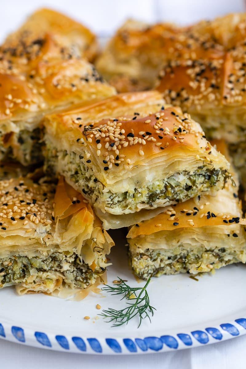 Greek Zucchini and Feta Phyllo Pie close up with slice taken out